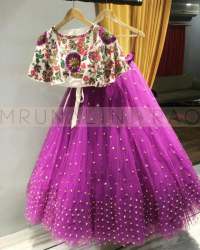 Purple Colored Blouse Embroidered Lehenga Cholli.