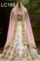White Color Tapeta Silk Lehenga Choli.