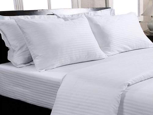 COTTON WHITE BED SHEET WITH PILLOW COVER .