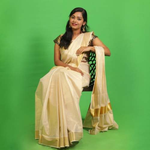 Rich gold Kerala saree with a gold border by K K Balusamy Co