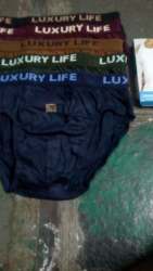 LUXURY LIFE CLOTHING,HOSIERY AND GARMENTS logo icon