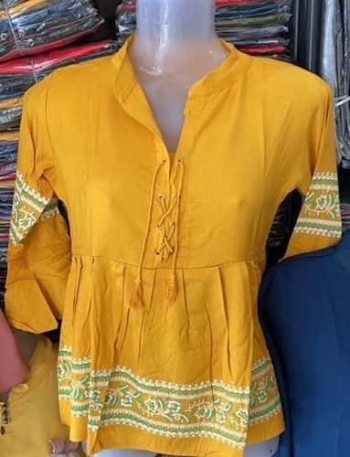 Party Wear Yellow Printed Top For Girls by Textile Cleaner