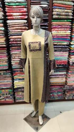 Stylish Creame Color Woolen Kurti by Rattan Selection