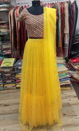 Yellow Net Crop Top Lehenga Choli by Mangalam Muhurat