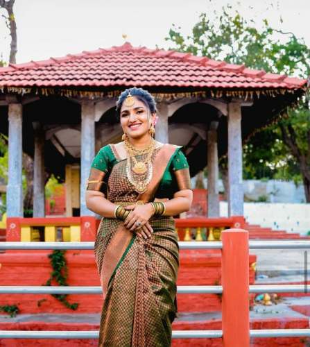 Green color banarasi silk saree with zari weaving work