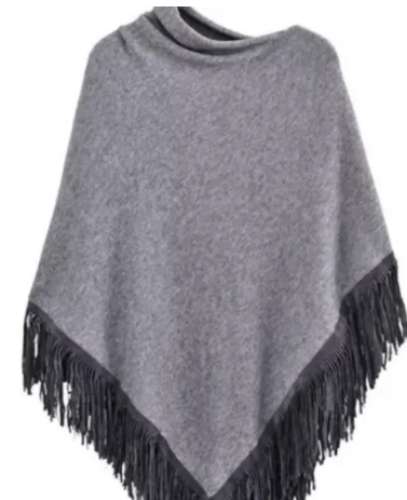 Knitted poncho with suede fringes by IMPEX CRAFTS